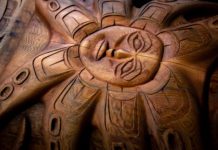 Totems hewn from 850-year-old tree will guard new science center